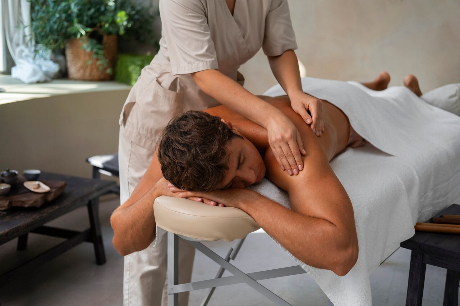 Person receiving a massage in a spa setting